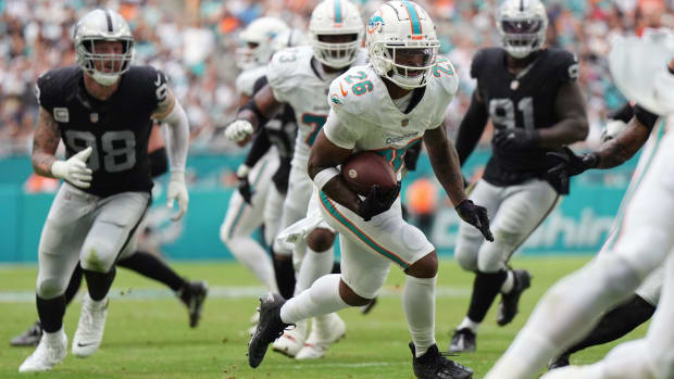 Salvon Ahmed looks for room to run against the Las Vegas Raiders.